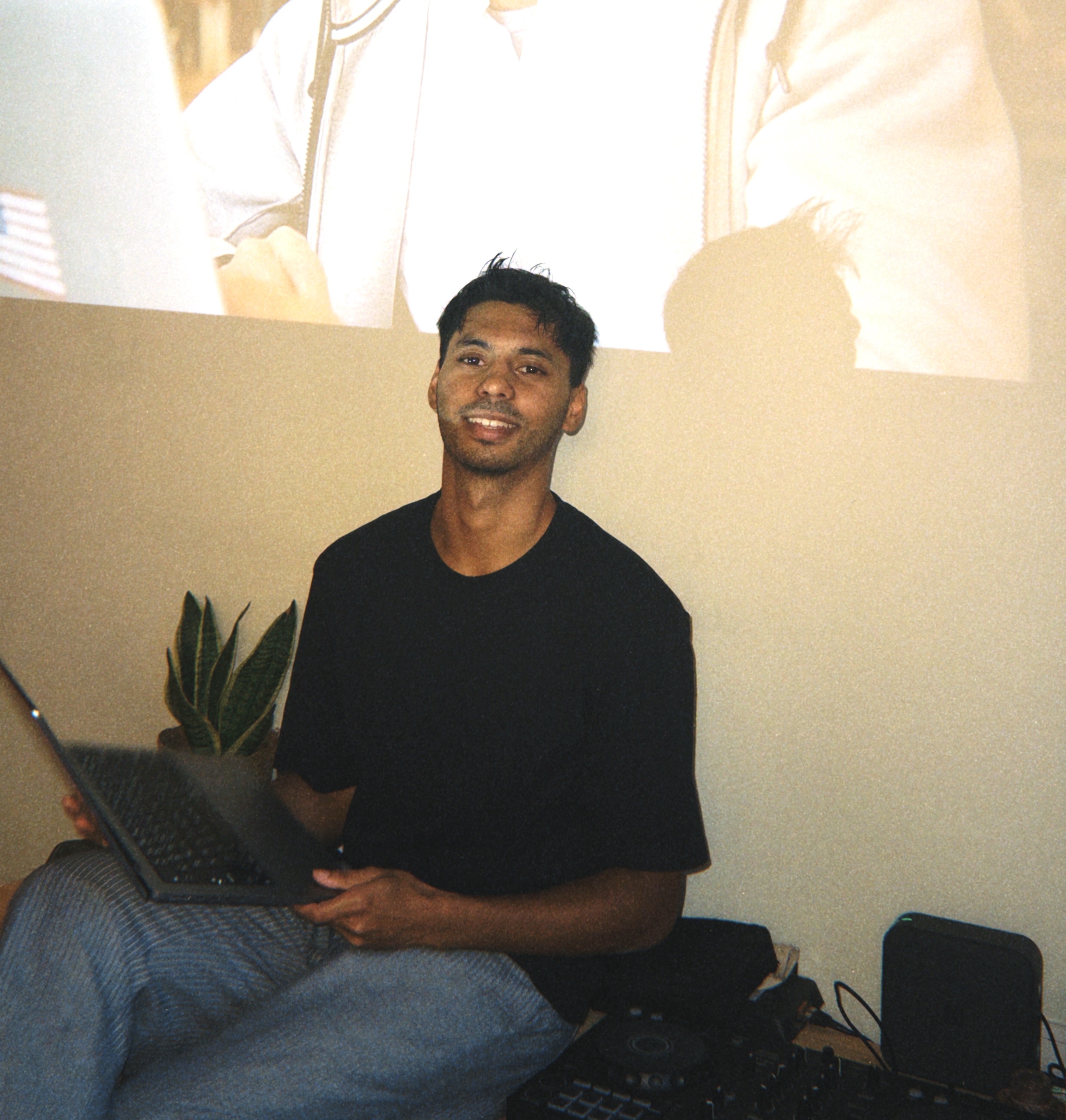 Aryan, sitting with his laptop